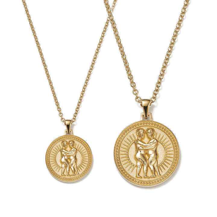 Small and Large Ethical Gold Gemini Pendant Necklaces Side By Side on a White Background