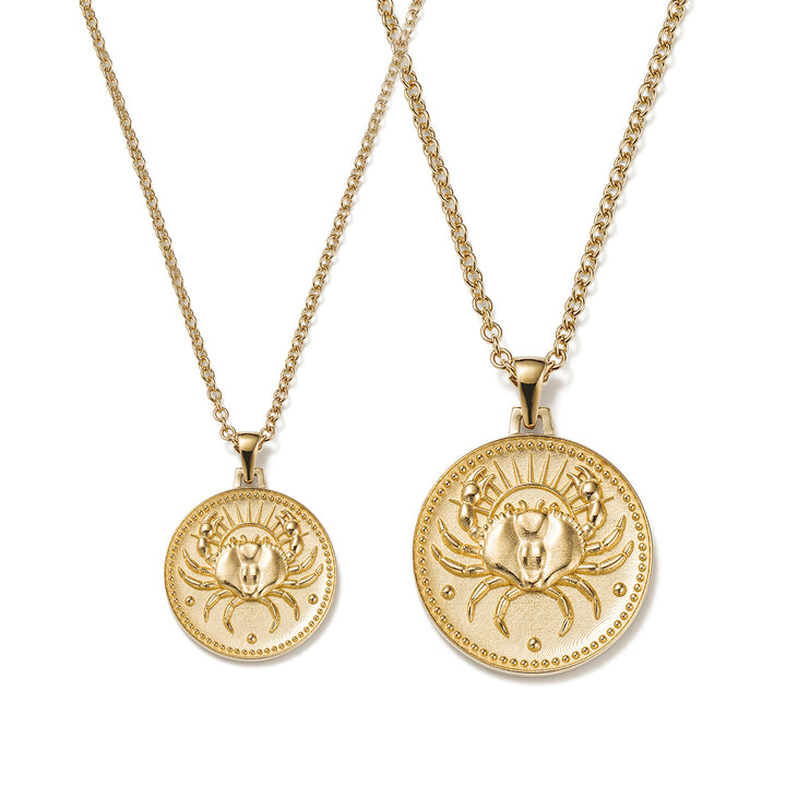 Small and Large Ethical Gold Cancer Pendant Necklaces Side By Side on a White Background