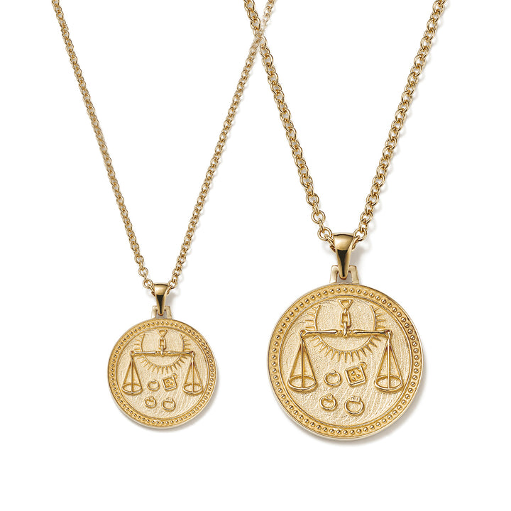 Small and Large Ethical Gold Libra Pendant Necklaces Side By Side on a White Background