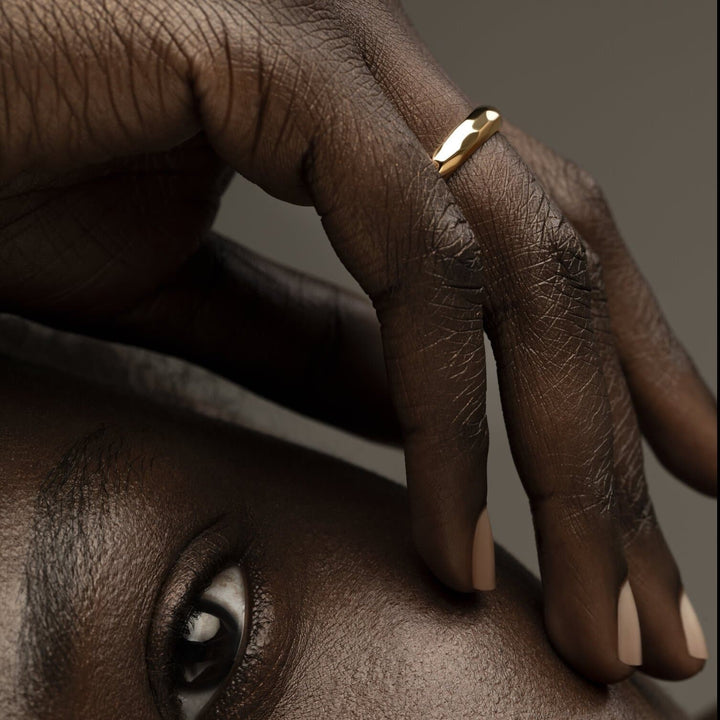 Model Wearing Enchantment Hammered Sustainable Gold Wedding Band/Ring