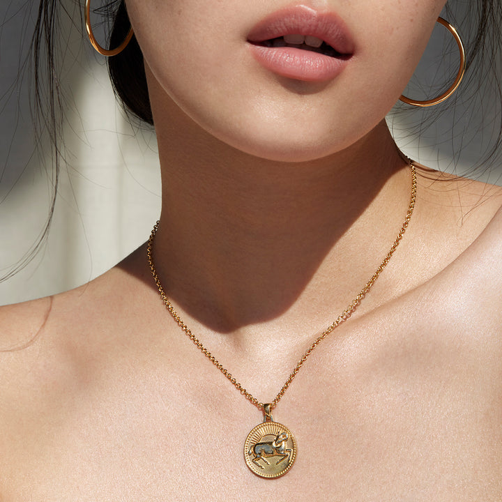 Woman from Lips to Shoulders Wearing Ethical Gold Aries Pendant Necklace