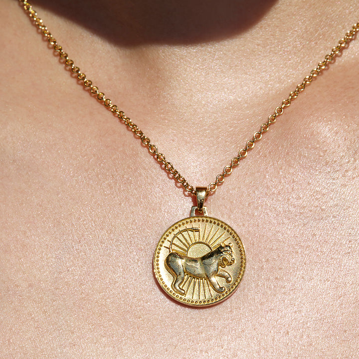 Close up of Leo Ethical Gold Pendant Necklace Being Worn Against Skin